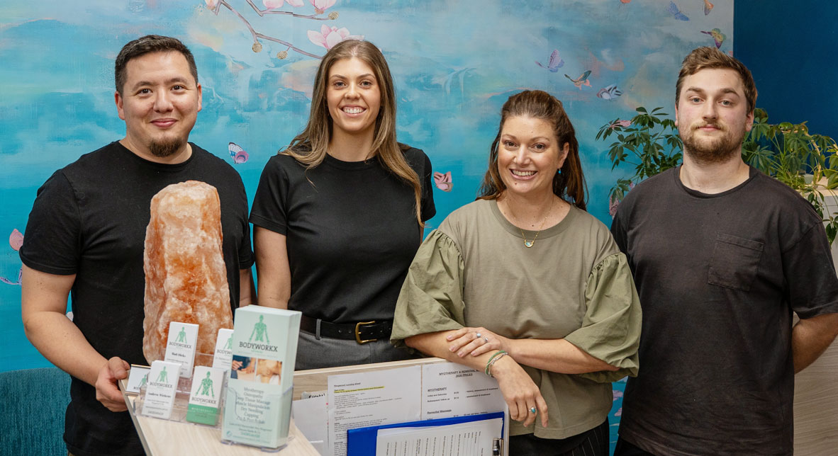 Team-at-desk-bodyworkx Meet the team at bodyworkx clinic in Ringwood and Eltham